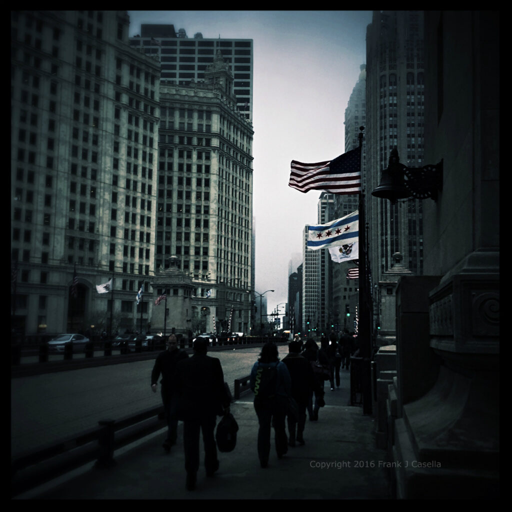 Fog covers city skyscrapers down Michigan Avenue during the morning commute in Chicago Illinois.